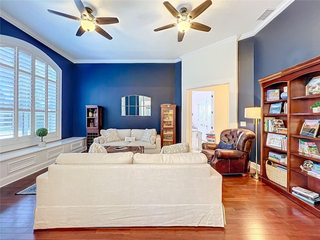 living room featuring hardwood / wood-style floors and crown molding