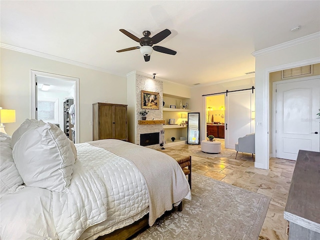 bedroom featuring ensuite bath, ornamental molding, ceiling fan, a spacious closet, and a closet