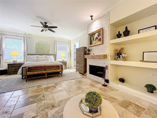 bedroom featuring a stone fireplace, ceiling fan, and crown molding