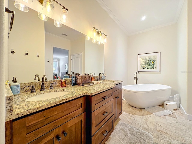 bathroom with a washtub, vanity, and ornamental molding