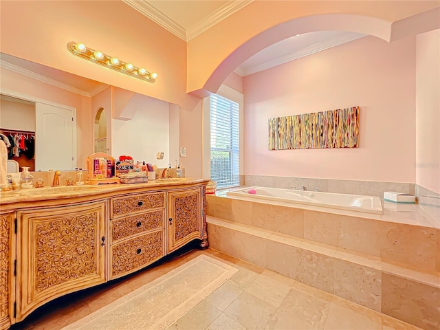 bathroom with vanity, a relaxing tiled tub, and ornamental molding