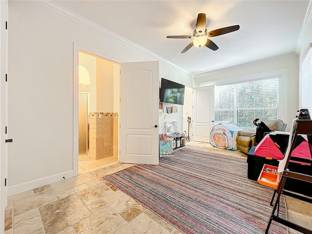 bedroom featuring ceiling fan, crown molding, and ensuite bath