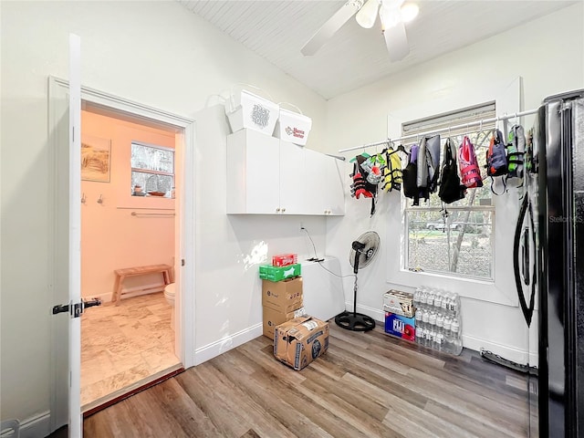 washroom with ceiling fan and light hardwood / wood-style floors