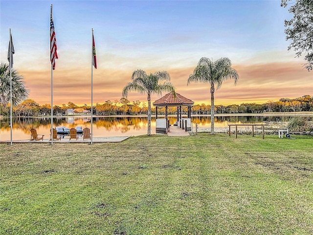 exterior space featuring a gazebo and a water view