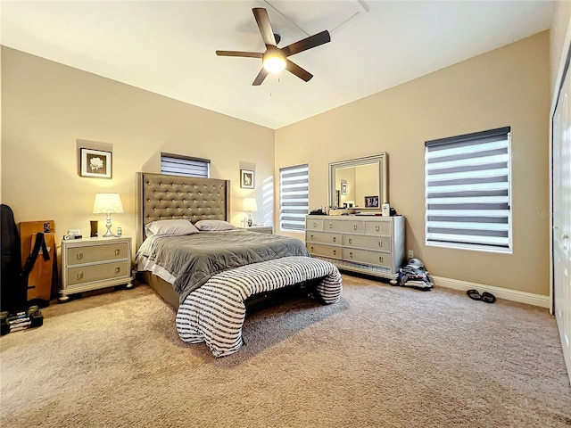 bedroom featuring ceiling fan and light carpet