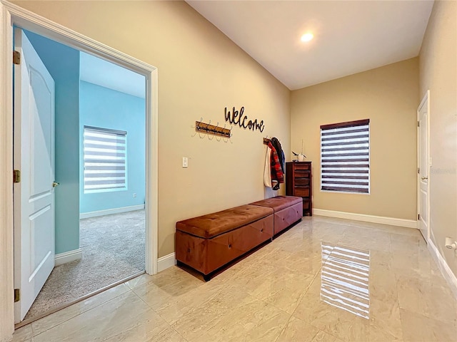 hallway with light carpet