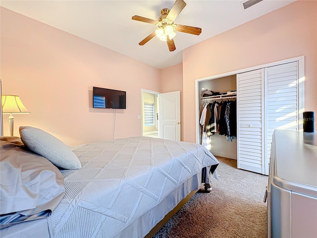 bedroom with carpet, a closet, and ceiling fan