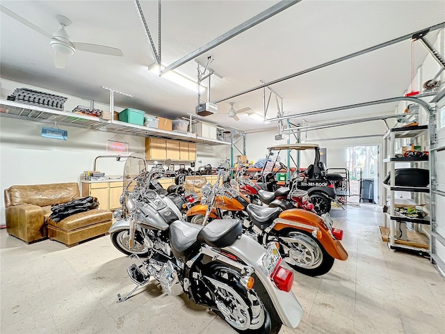 garage with a garage door opener and ceiling fan