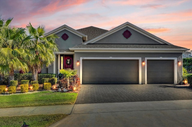 view of front of home with a garage