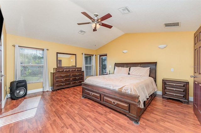 bedroom featuring ceiling fan, vaulted ceiling, and dark hardwood / wood-style floors