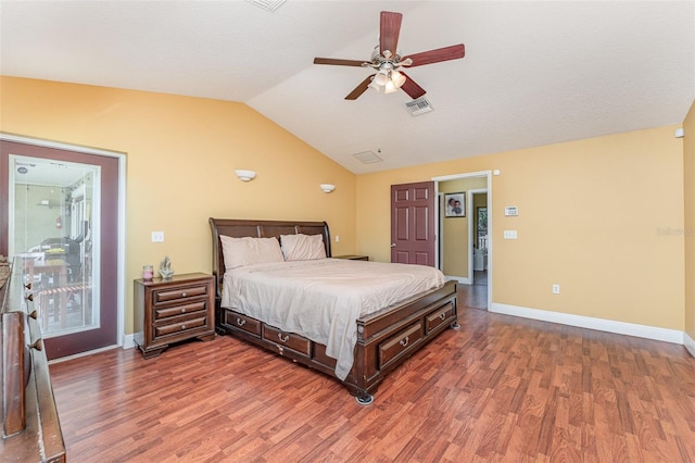 bedroom with lofted ceiling, dark wood-type flooring, and ceiling fan