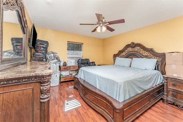 bedroom featuring ceiling fan and wood-type flooring