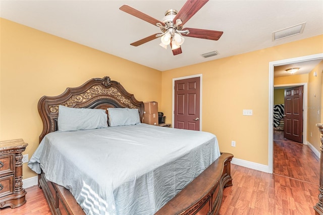 bedroom featuring ceiling fan and hardwood / wood-style flooring