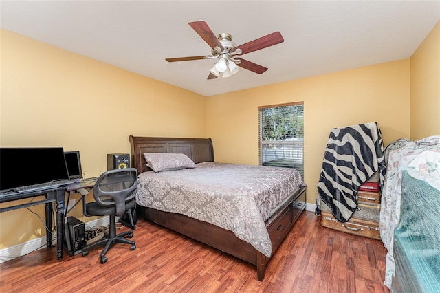 bedroom featuring ceiling fan and dark wood-type flooring