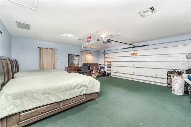 bedroom featuring a textured ceiling and carpet flooring