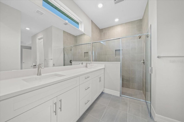 bathroom featuring vanity, tile patterned floors, and an enclosed shower