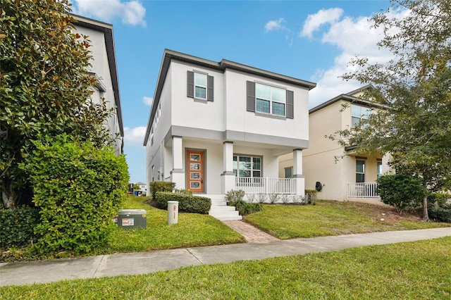 view of property with a porch and a front lawn