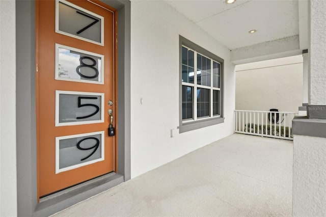 doorway to property featuring a porch