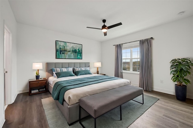 bedroom with hardwood / wood-style flooring and ceiling fan