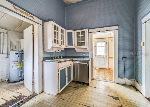 kitchen featuring stainless steel dishwasher, white cabinets, sink, and water heater