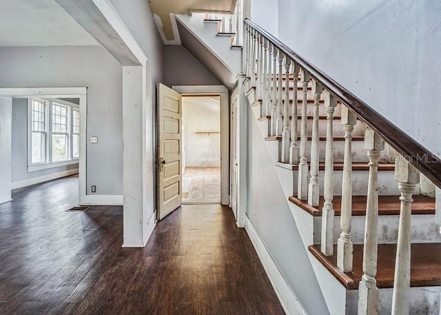 staircase featuring wood-type flooring