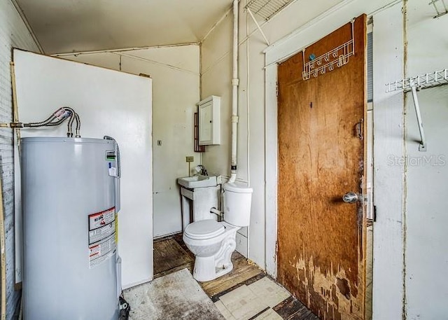 utility room featuring sink and water heater