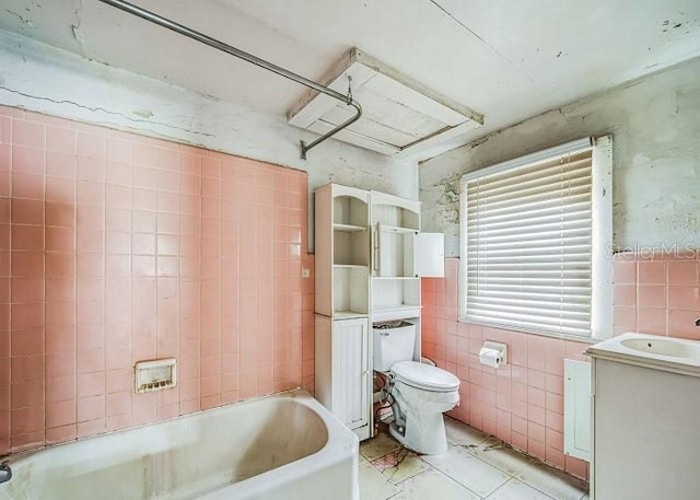 full bathroom featuring vanity, bathtub / shower combination, tile patterned floors, toilet, and tile walls