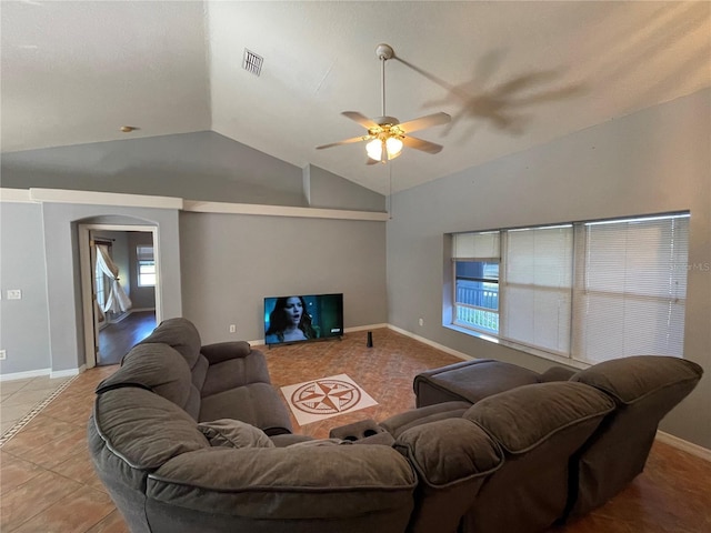 tiled living room with vaulted ceiling and ceiling fan