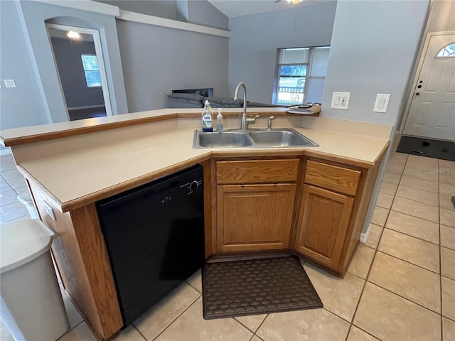 kitchen with dishwasher, light tile patterned floors, kitchen peninsula, and sink