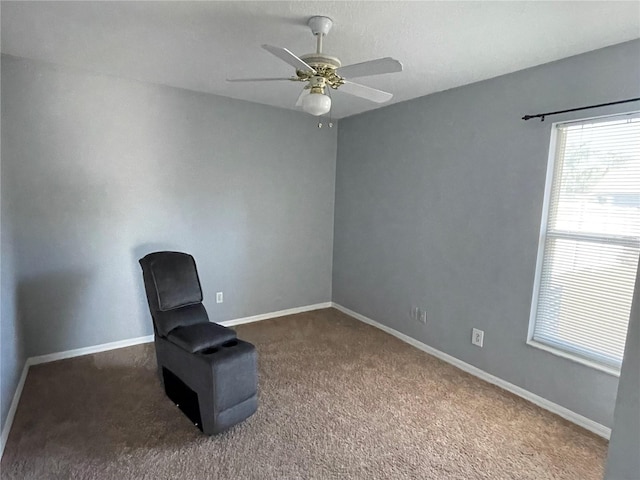 unfurnished room featuring dark colored carpet and ceiling fan