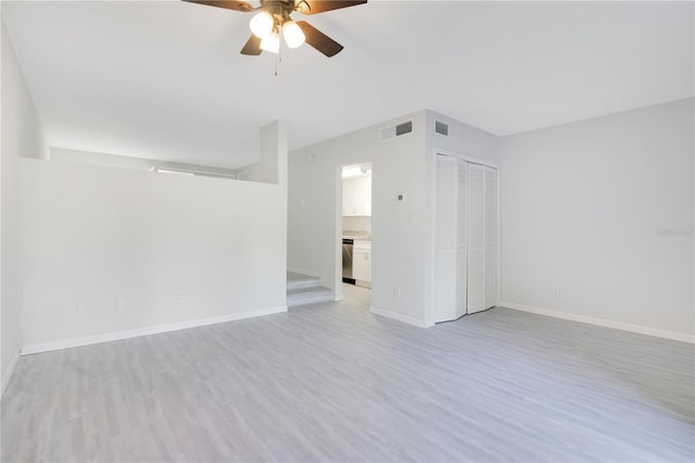 unfurnished room featuring light hardwood / wood-style floors and ceiling fan