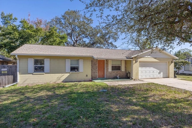 single story home featuring a front lawn and a garage