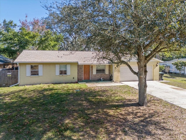 ranch-style home with a garage and a front lawn