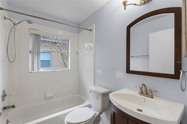 full bathroom featuring vanity, toilet, and tiled shower / bath