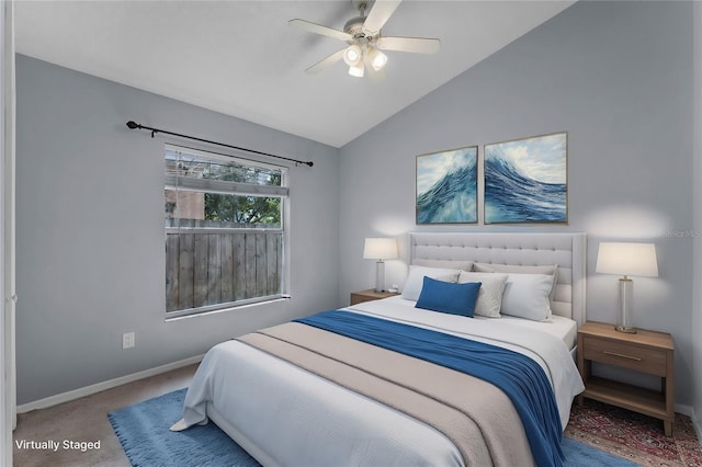 bedroom featuring vaulted ceiling, ceiling fan, and carpet flooring