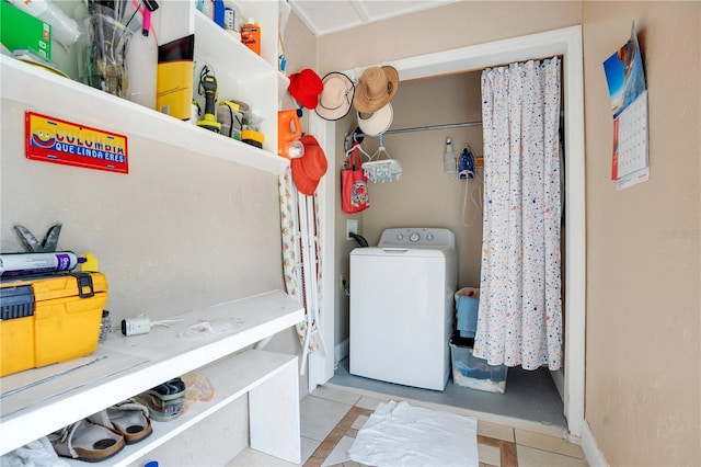 743 Golden Sunshine Cir, Orlando, FL 32807 - washroom featuring washer / dryer and light tile patterned floors