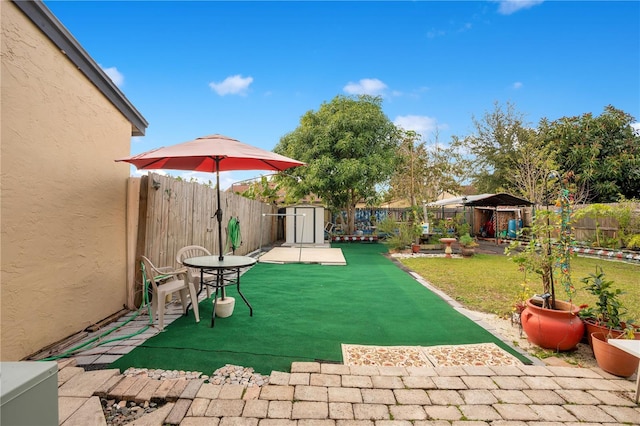 743 Golden Sunshine Cir, Orlando, FL 32807 - view of patio with a storage unit