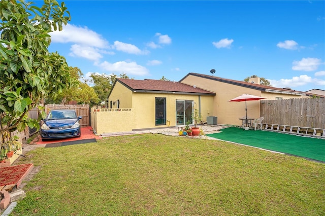 743 Golden Sunshine Cir, Orlando, FL 32807 - rear view of house featuring a lawn and cooling unit