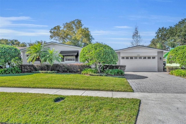 view of front facade featuring a front lawn and a garage