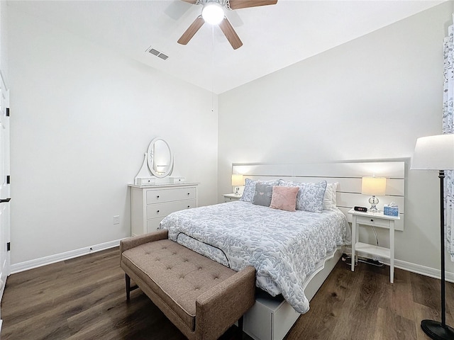 bedroom with a ceiling fan, baseboards, visible vents, and wood finished floors