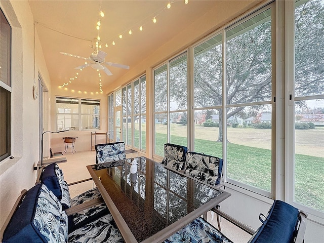 sunroom featuring ceiling fan