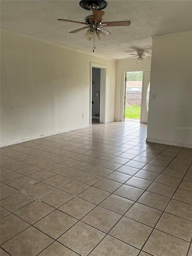 tiled spare room featuring ceiling fan and a textured ceiling