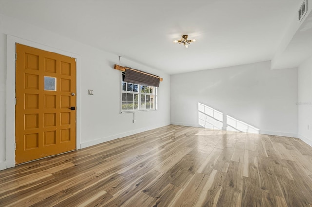 foyer entrance with hardwood / wood-style floors