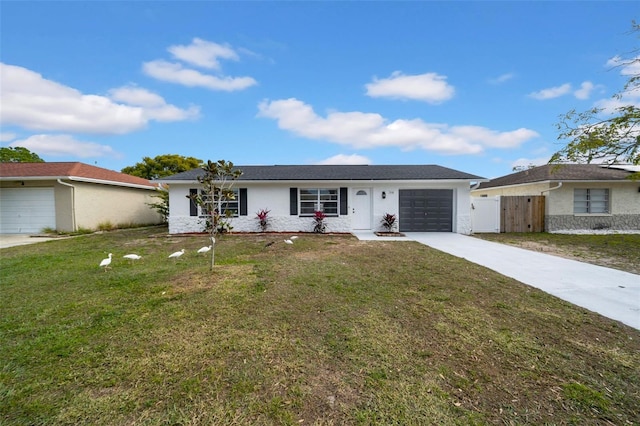 ranch-style house with a garage and a front lawn