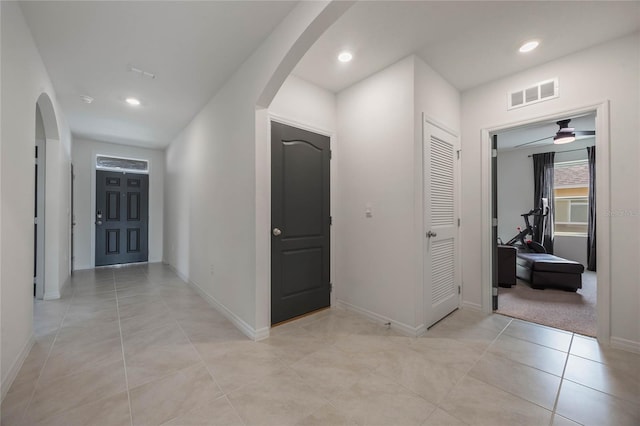 corridor with light tile patterned flooring