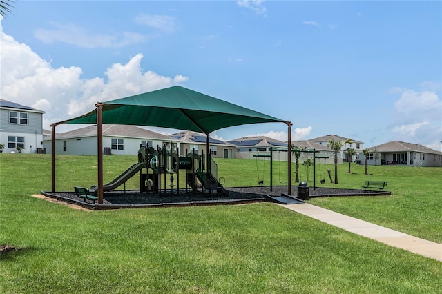 view of jungle gym with a lawn