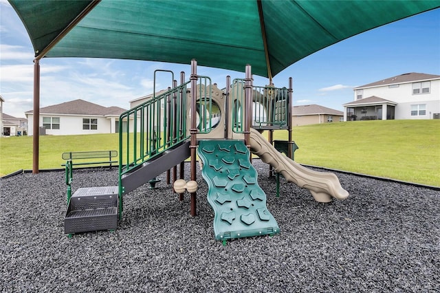 view of playground with a lawn