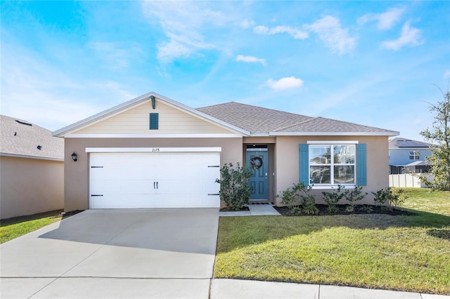 ranch-style house with a garage and a front yard