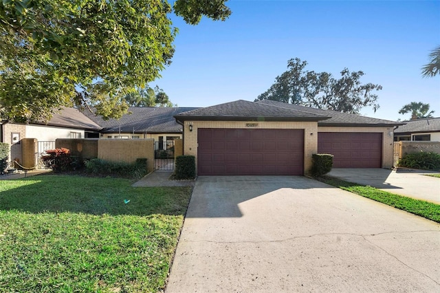 view of front of home with a garage and a front lawn