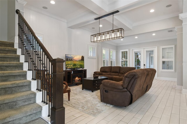 living room with beamed ceiling, ornamental molding, coffered ceiling, and french doors